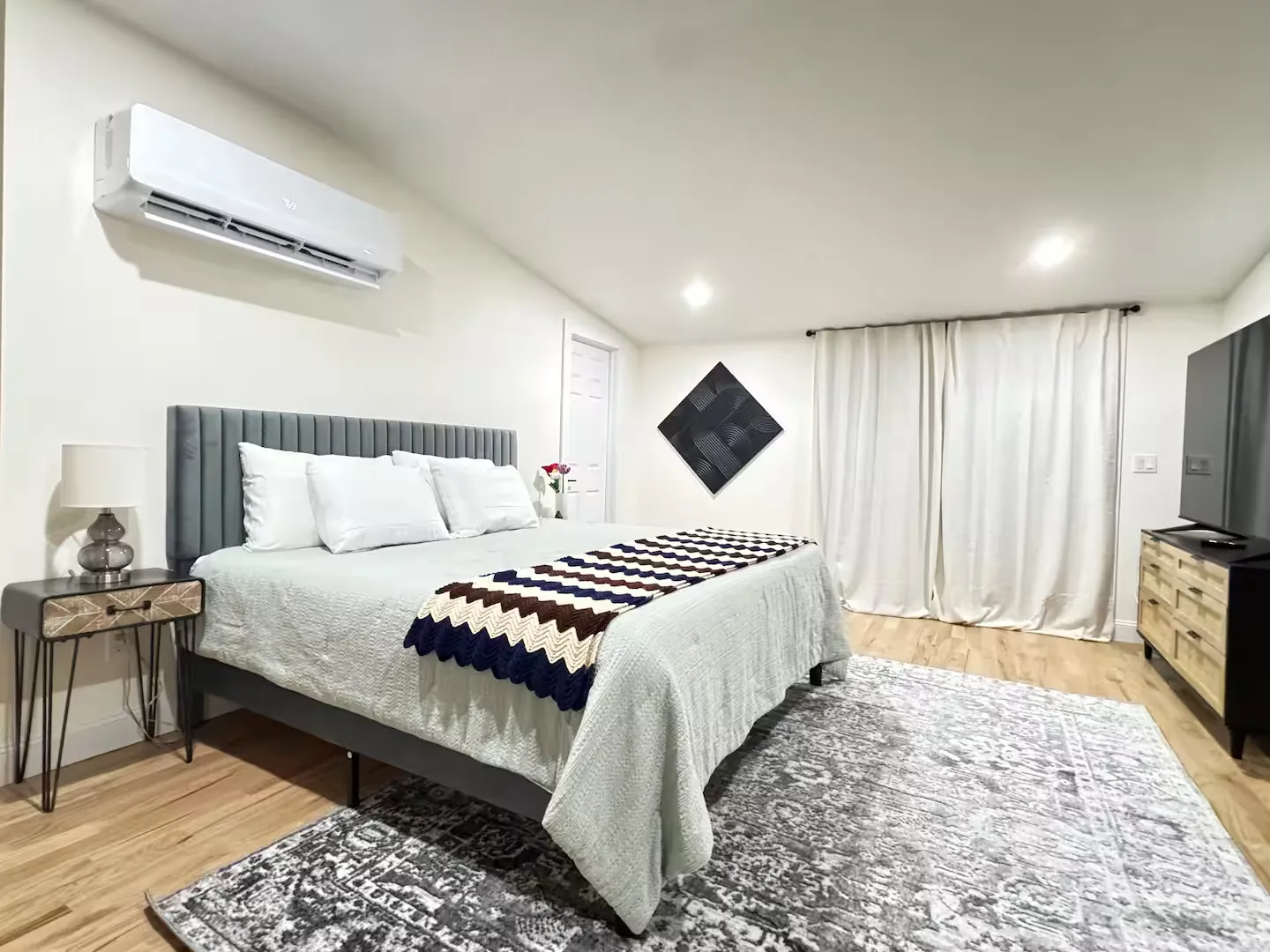 Bedroom with king bed and smart TV